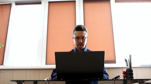 Manager at the computer. Businessman working with laptop Stock Footage 87699699