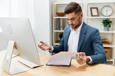 Manager computer desktop work self-confidence paper folder Gray background Stock Photos