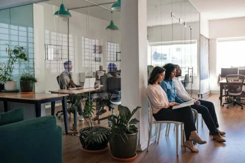 Manager conducting interviews with a group of applicants at work Stock Photos