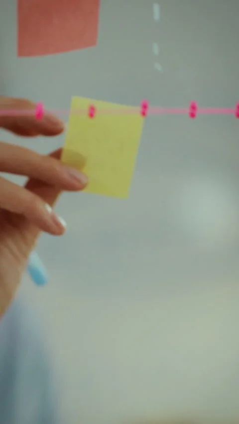 Manager consultant engages in brainstorming session with sticky notes in mod Stock Footage 331643979
