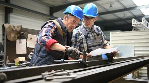 Manager controlling employee's metallurgy work Stock Footage 63389017