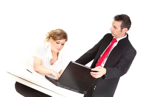 Manager controls the secretary while work with computer Stock Photos