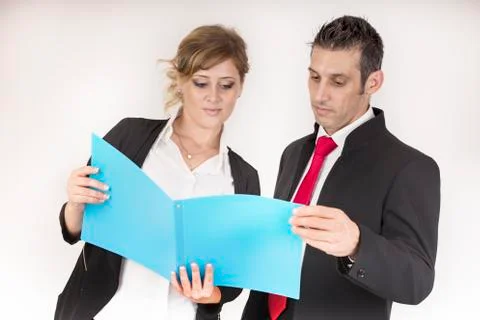 Manager controls the work of the secretary in a colored folder Stock Photos
