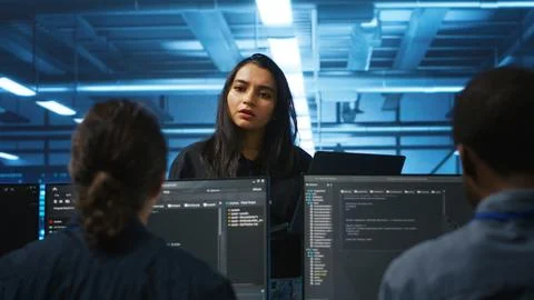Manager coordinating tech specialists fixing data center damages Stock Photos