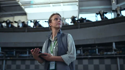Manager dairy farm checking production facility. Supervisor holding pad computer Stock Footage 184886553