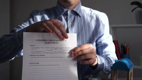 The manager of the developer  presents the construction contract 스톡 동영상 306543167