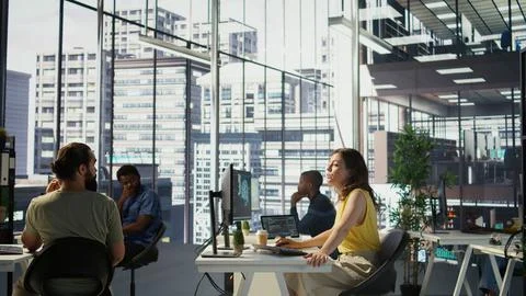 Manager discussing with employees in office, developing artificial intelligence Stockfoto's
