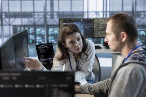 Manager discussing with worker, implementing server virtualization 写真素材