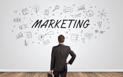 Manager in doubt looking to a wall with business concept Foto stock