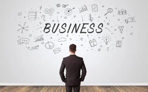 Manager in doubt looking to a wall with business concept Stock Photos