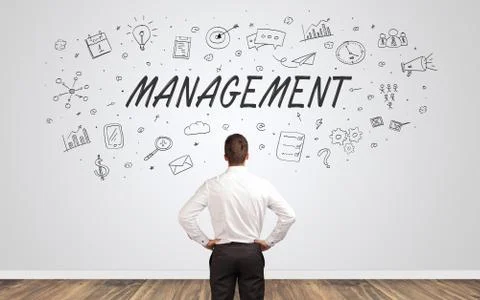 Manager in doubt looking to a wall with business concept 스톡 사진