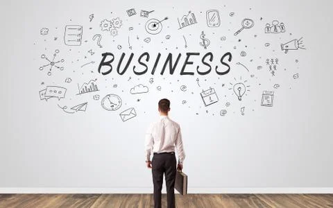 Manager in doubt looking to a wall with business concept Foto stock