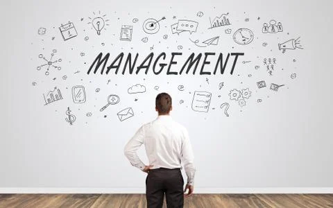 Manager in doubt looking to a wall with business concept Foto stock
