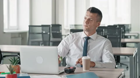 Manager drinking coffee at workplace Stock Footage 171631681