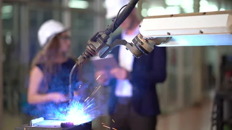 Manager engineer control  Welding robot arms machine discuss with business wo Stock Footage 154486864