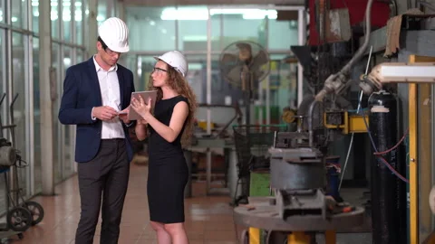 Manager engineer control  Welding robot arms machine discuss with business wo Stock Footage 154487297