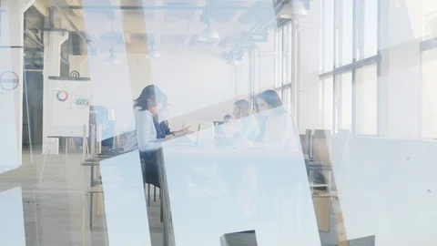 The manager enters the loft-style office space, welcomes colleagues and sits Stock Footage 109418431