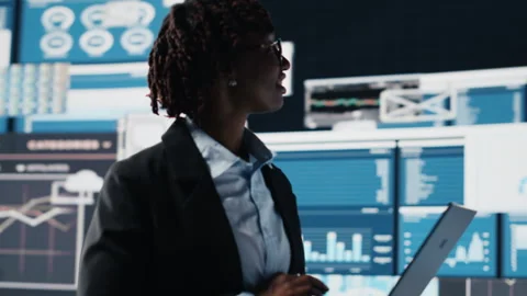 Manager evaluating business market graphs using laptop software Stock Footage 318625569