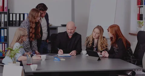 Manager explaining strategy to colleagues in meeting Stock Footage 171579179