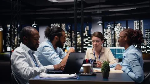 Manager gathering employees in office, evaluating staff performance Stock Photos