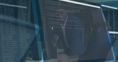 Manager gesturing across table guiding developer reviewing evolving code Stock Footage 317600177