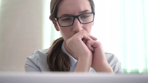 The manager girl frowns at work Stock Footage 182009953