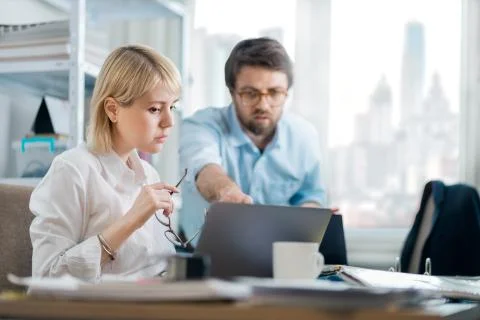 Manager giving feedback to young intern Stock Photos
