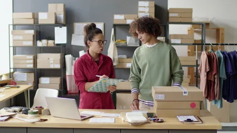 Manager Giving Parcels to Courier in Delivery Service Office 動画素材 228480856