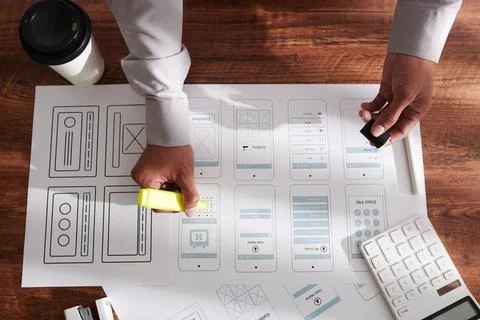 Manager Highliting Elements on Printed Mockups Stock Photos