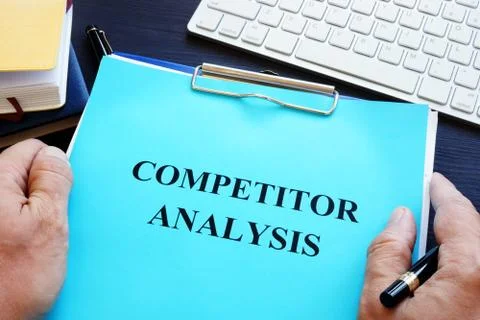 Manager is holding competitor analysis. Stock Photos
