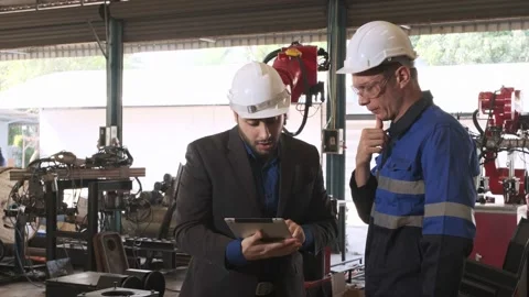 Manager holding tablet talk engineer to check automated in the factory. Stock Footage 233180401