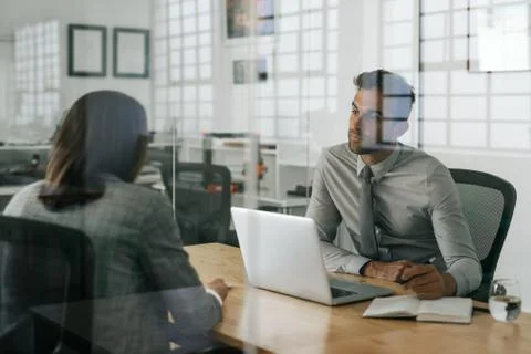 Manager interviewing a job applicant inside of his office Foto stock