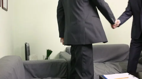 Manager interviewing a male applicant in his office. Two men in business suits Stock Footage 63203462