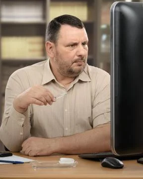 Manager learns injection technique online Stock Photos