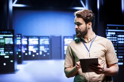 Manager looking at server rigs Stock Photos