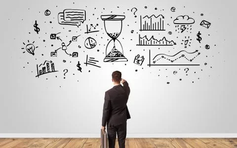 Manager looking to wall with overloaded brain concept Stock Photos