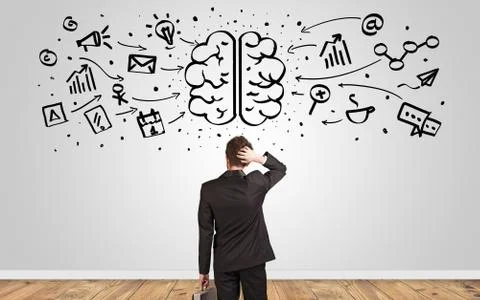 Manager looking to wall with overloaded brain concept Stock Photos
