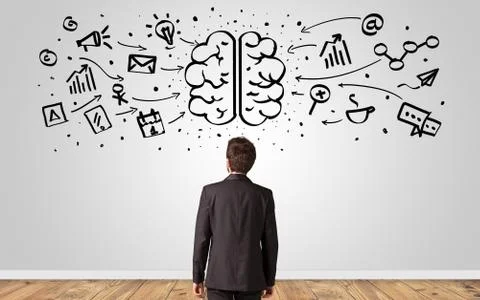 Manager looking to wall with overloaded brain concept Stock Photos