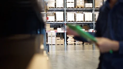 Manager man worker doing stocktaking of product management in cardboard Video stock 115979140