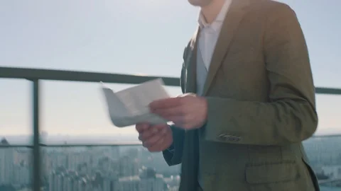Manager moves quickly on the roof of a skyscraper Stock Footage 128525871