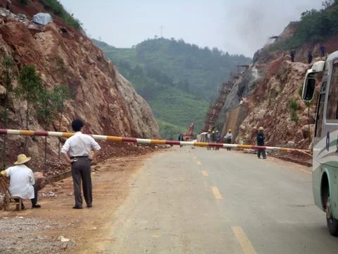Manager observing road workers in China Stock Photos
