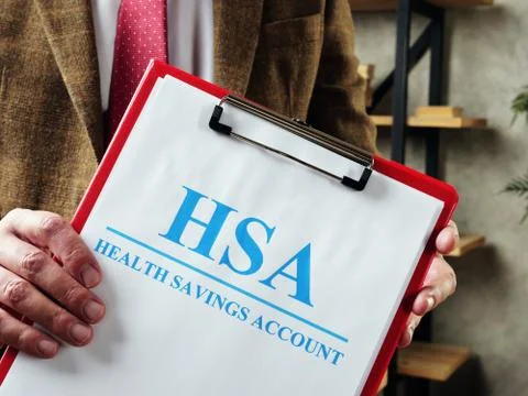 The manager offers documents about HSA Health savings account. Stock Photos