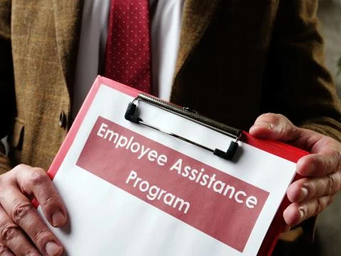 The manager offers Employee Assistance Program EAP papers. Stock Photos