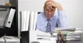 Manager at Office in Accounting Department Working to Solve All Paper Documents 4k or 4k+ Resolution