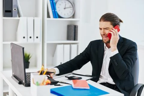 Manager office work documents with a phone in hand technology Stock Photos