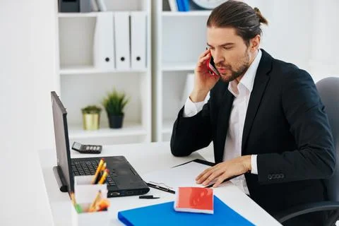 Manager office work documents with a phone in hand technology Stock Photos