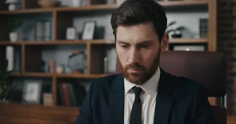 Manager opens laptop and starts working. Man portrait in cinematographic light Stock Footage 170224090