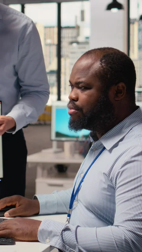 Manager overseeing engineer using CAD app to optimize wind turbine design Stock Footage 315415752