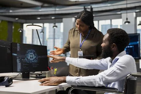 Manager overseeing tasks progress done by worker with paraplegia using AI Stock Photos