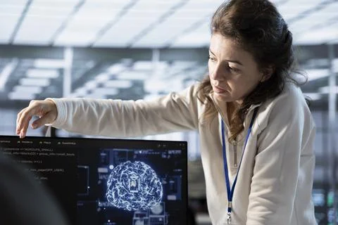 Manager overseeing worker doing data center automation using AI tools Stock Photos